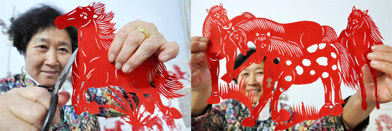 Chinese woman cutting paper to make horse art for Chinese New Year 2014