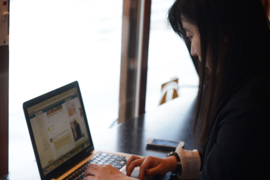 LAT Multilingual woman at computer