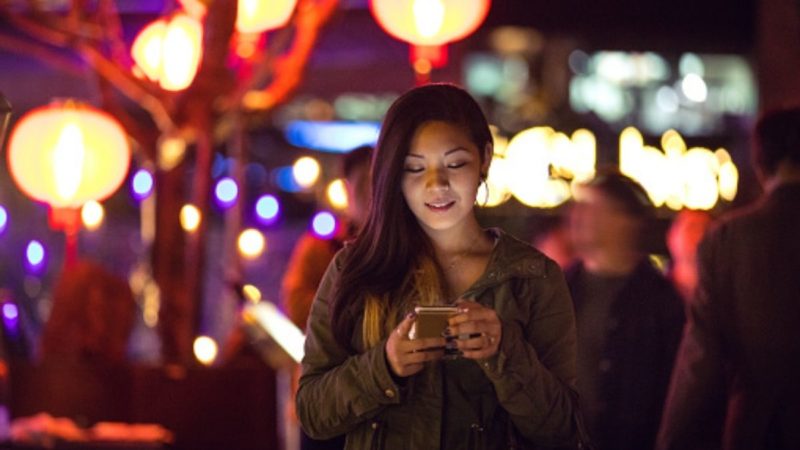 woman on phone - Connect with chinese customers Lunar New Year 2022